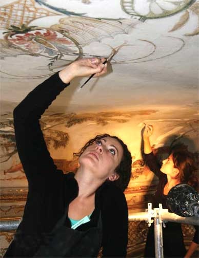 Conservationist at work on ceiling, Grand Singerie, 2008. © World Monuments Fund