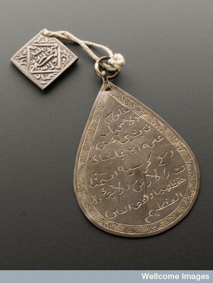 L0057456 Silver pear shaped pendant with silver square rupee, Middle