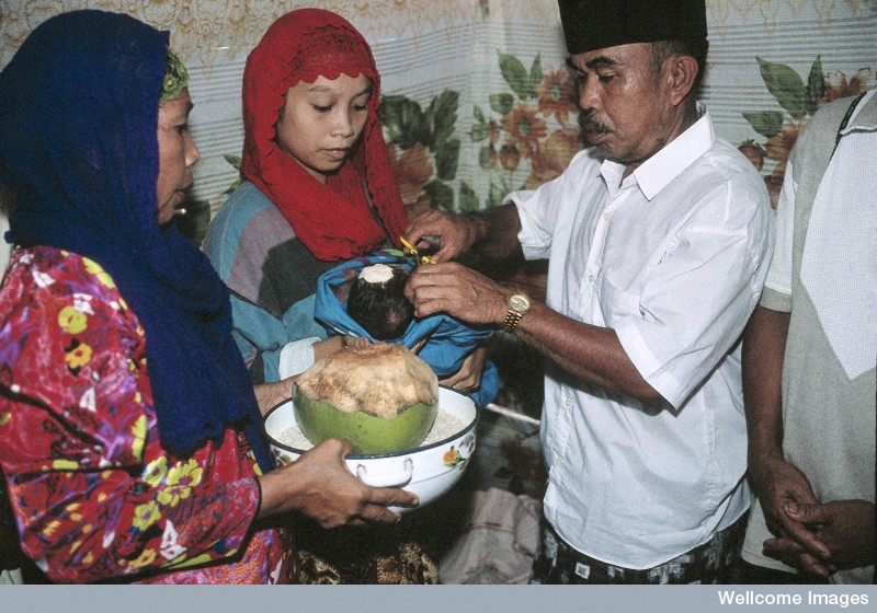 N0026600 Life in rural Indonesia. Blessing the child.