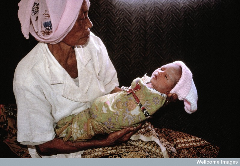 N0026596 Life in rural Indonesia. Baby and carer
