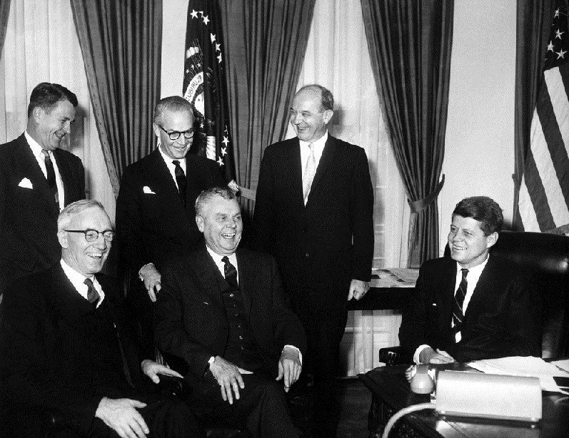 President John F. Kennedy meets with Prime Minister John G. Diefenbaker of Canada in the Oval Office, White House, Washington, D.C. (L-R) Seated: President Kennedy; Prime Minister Diefenbaker; Secretary of State for External Affairs of Canada Howard C. Green. (L-R) Standing: Secretary of State Dean Rusk; Canada Ambassador to the United States Arnold (A.D.P.) Heeney; United States Ambassador to Canada Livingston T. Merchant.Abbie Rowe. White House Photographs. John F. Kennedy Presidential Library and Museum, Boston