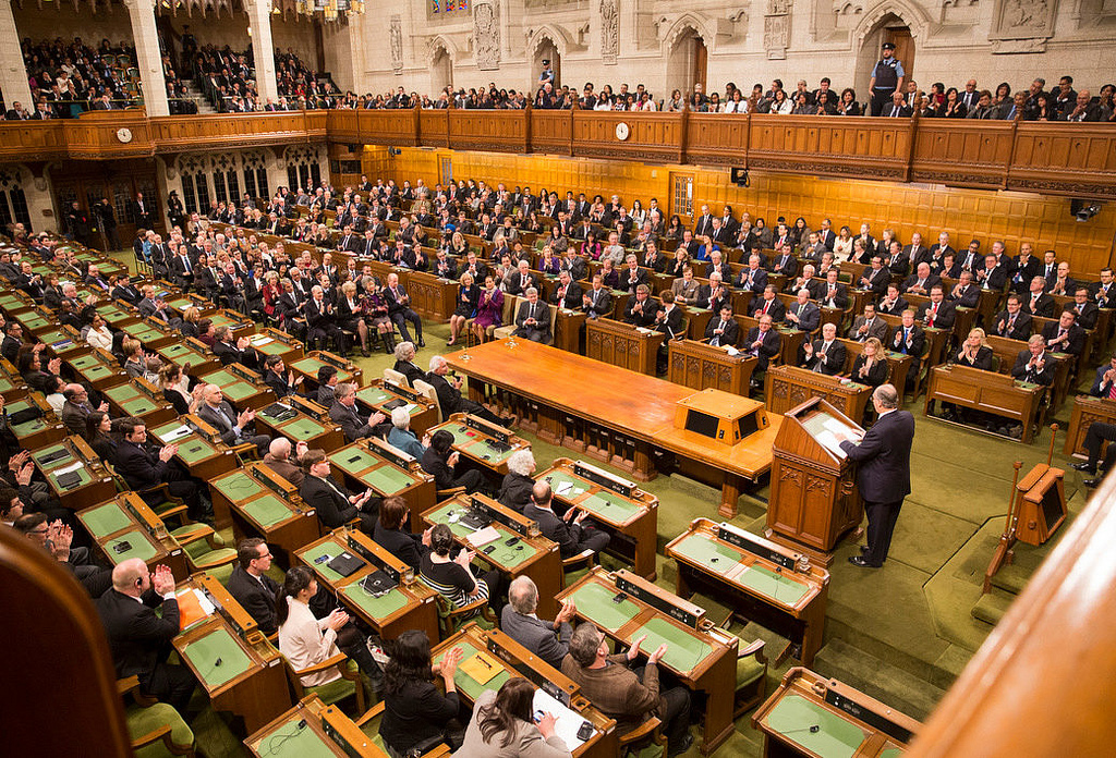 His Highness the Aga Khan seen addressing at the House of Commons Chambers to both the houses of Canadian Parliament on Thursday, February 27, 2014. Photograph: The Office of the Prime Minister of Canada.