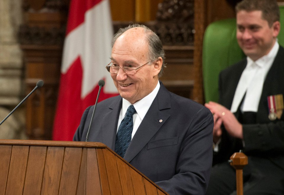 His Highness the Aga Khan seen smiling in a lighter moment during his address to both the Houses of the Canadian Parliament on Thursday, February 27, 2014. Referring to the two gold medals won by the Canadian hockey teams in the Sochi Olympics, the Ismaili Imam remarked, "As an ex-player myself I was hoping you would require your honorary citizens to join your team. I am convinced that the Dalai Lama and I would have been a formidable defence." Photo credit : The Office of the Prime Minister of Canada.