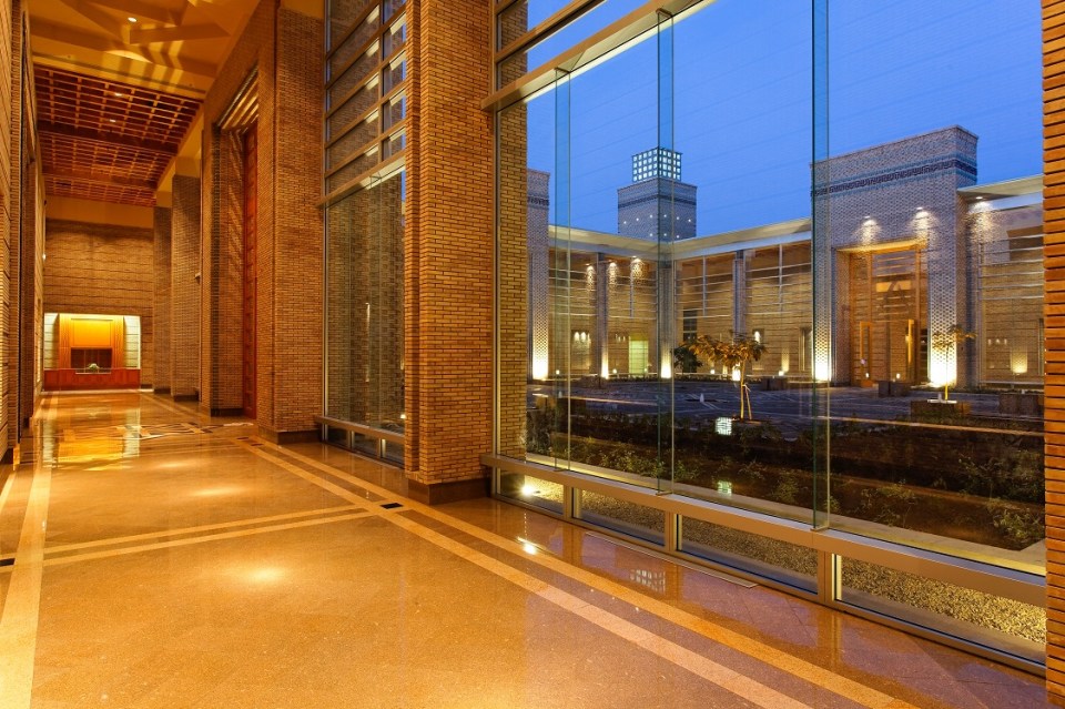 A view at night from hallway of the Ismaili Centre Dushanbe into the great court. Photo: FNDA Architecture Inc. Copyright.