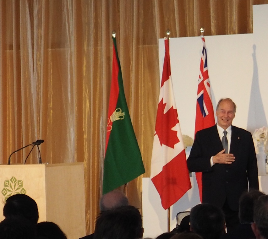 Mawlana Hazar Imam graciously accepts the standing ovation he receives after completing his speech at the opening of the Aga Khan Park on May 25, 2015. Photo: Simerg/Malik Merchant. Copyright.