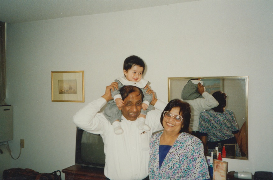 052 Nurin enjoying a shoulder lift by her grandfather Alwaez Merchant