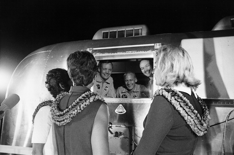 40147_Apollo 11 astronauts, still in their quarantine van, are greeted by their wives upon arrival at Ellington Air Force Base