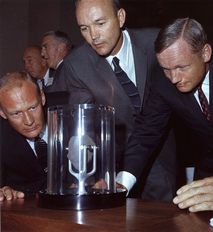 ap11-69-HC-967_Apollo 11 astronauts examine a lunar sample