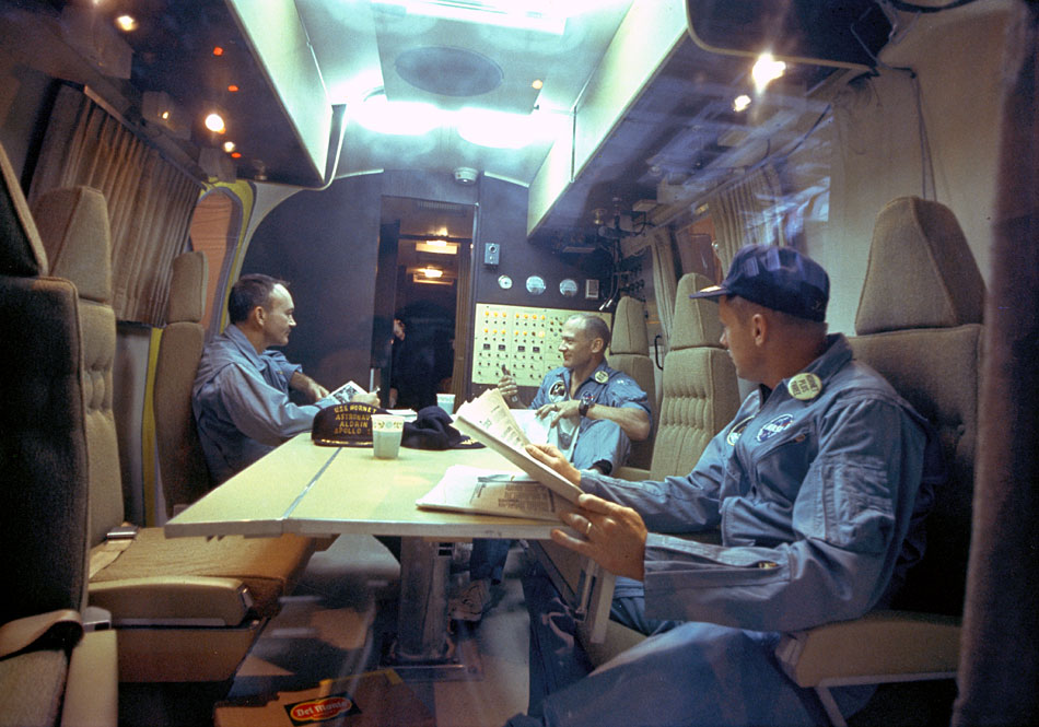 ap11-KSC-69PC-485_The Apollo 11 crew relaxes in the quarantine van
