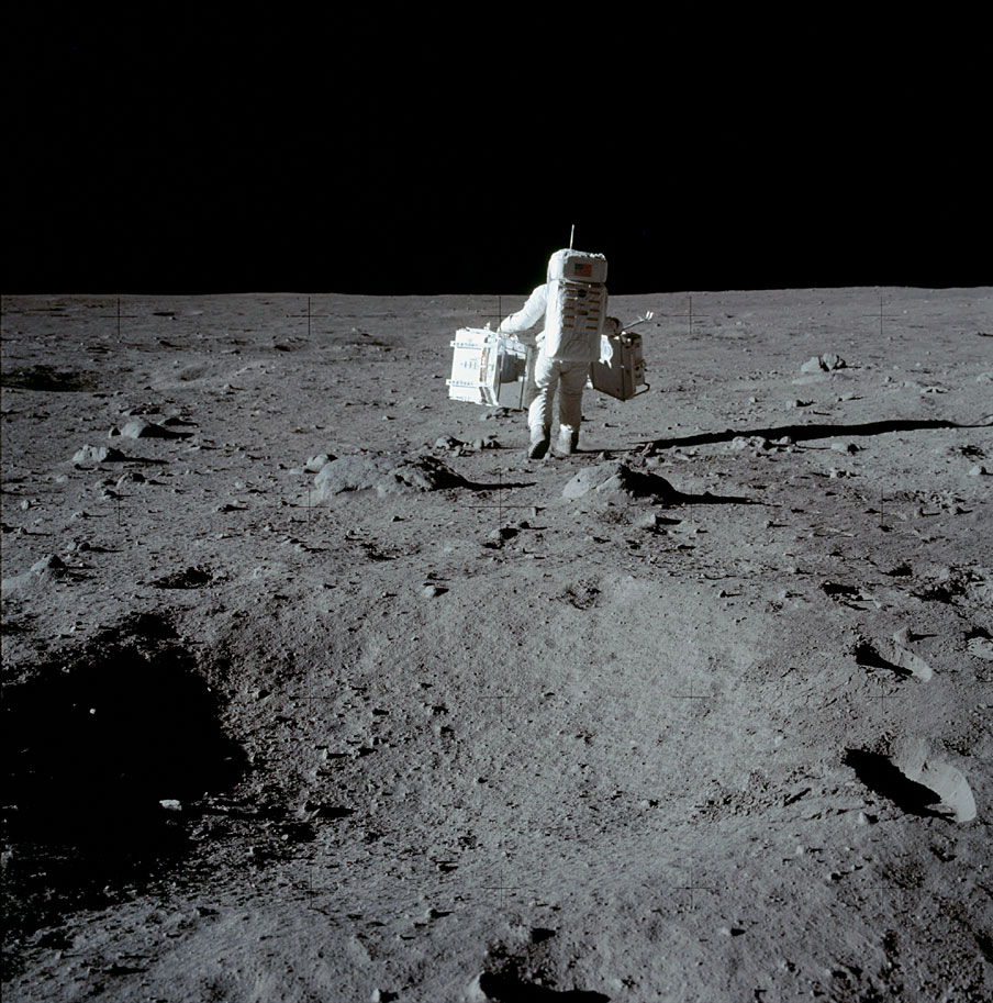 AS11-40-5944_Aldrin with experiment packages