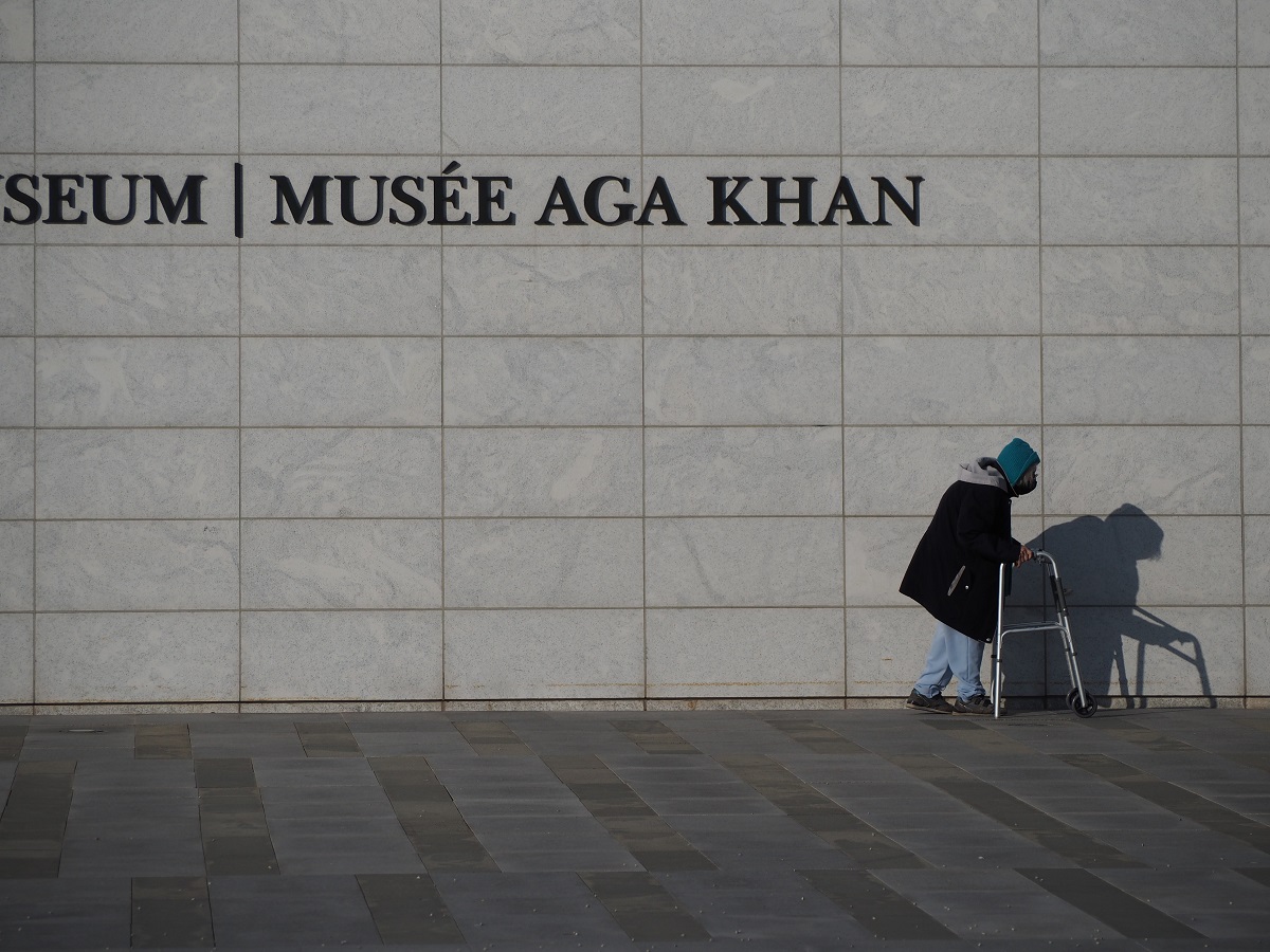 senior citizen at Aga Khan Museum pushing her walker, simergphotos malik merchant