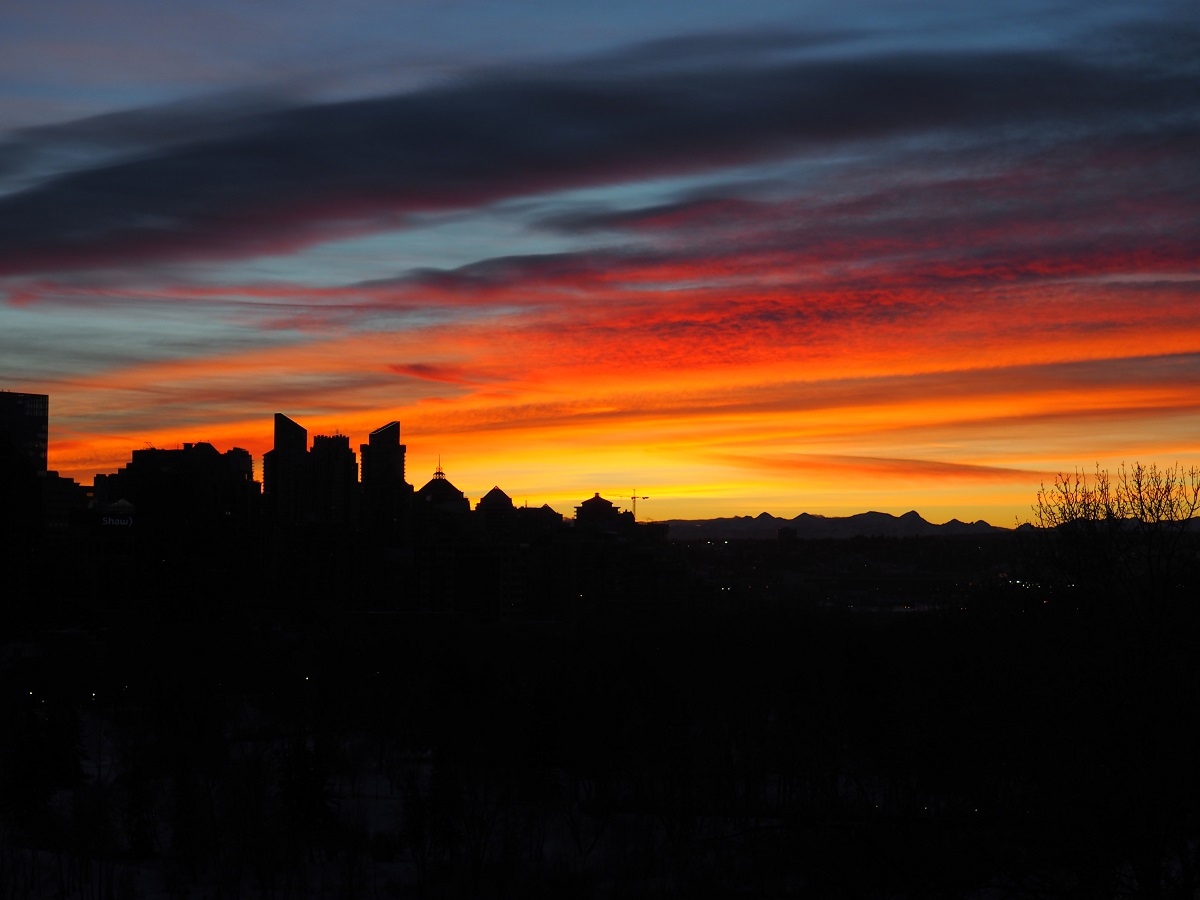 ntains in the distance and a small section of the Calgary skyline captured from Crescent Heights Lookout Point located in McHugh Bluff. Malik Merchant, Simerg
