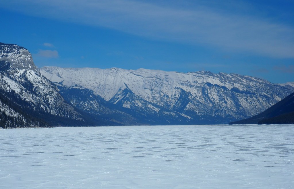 Mountains around the frozen Lake Minnewanka, Banff National Park,