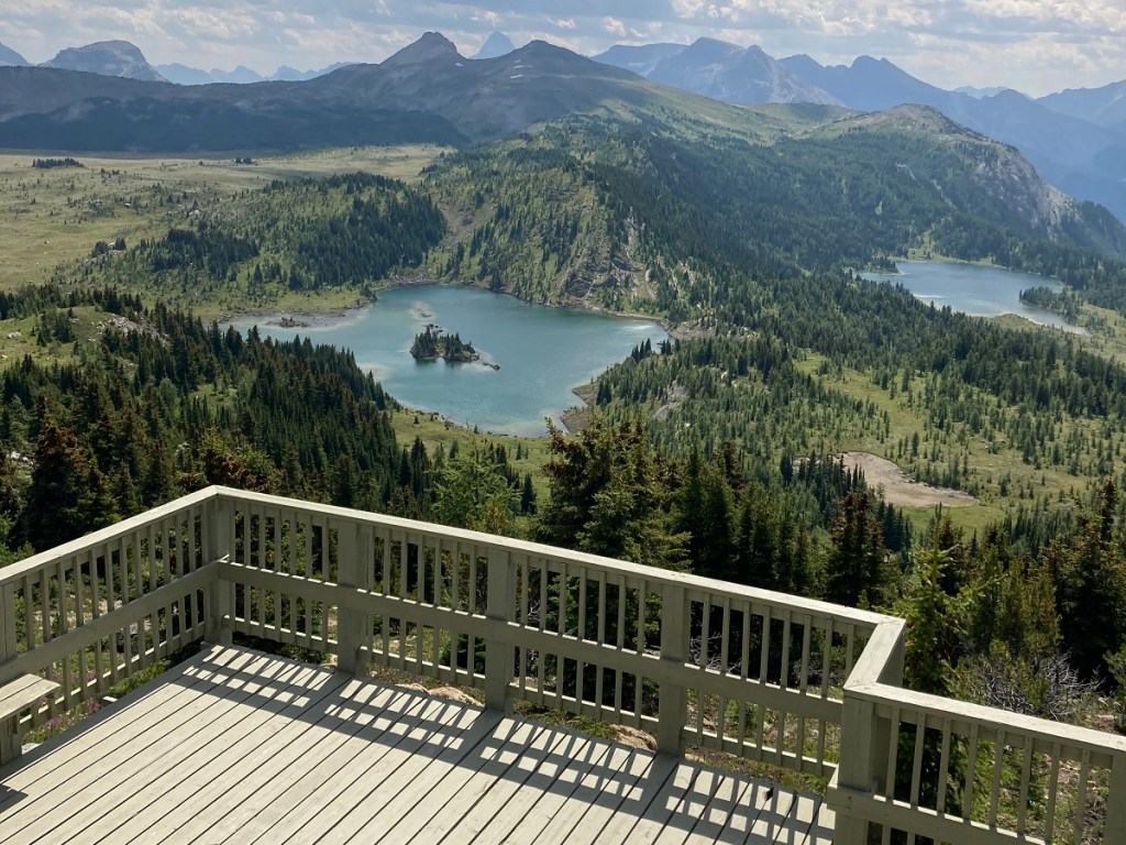 breathtaking view of Rock Isle Lake (left) and Larry Lake from Banff Sunshine's Standish Viewing Deck; July 30, 2023. Photograph: Malik Merchant/Simerg Photos.