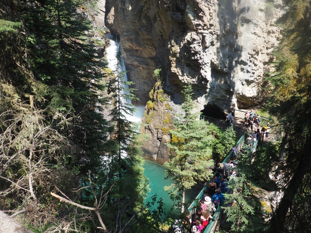 Lower Falls with cave entrance Johnston Canyon, Bow Valley Parkway, Hwy 1A runs between Banff and Lake Louise