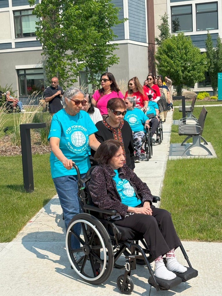 Care residents on walkers and wheelchairs in support of the Aga Khan Foundation World Partnership Walk, Generations Calgary, June 8, 2025. Photograph: Malik Merchant / Simerg Photos.