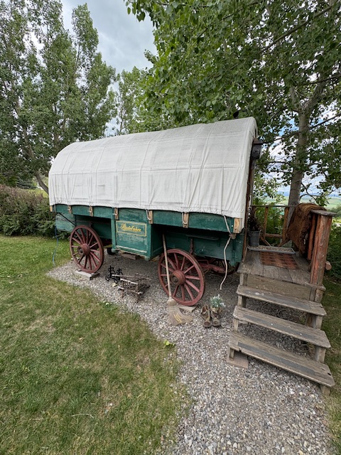 This compact glamping unit is perfectly outfitted for 2 people with her double bed, retractable table, built in bench seating and storage are